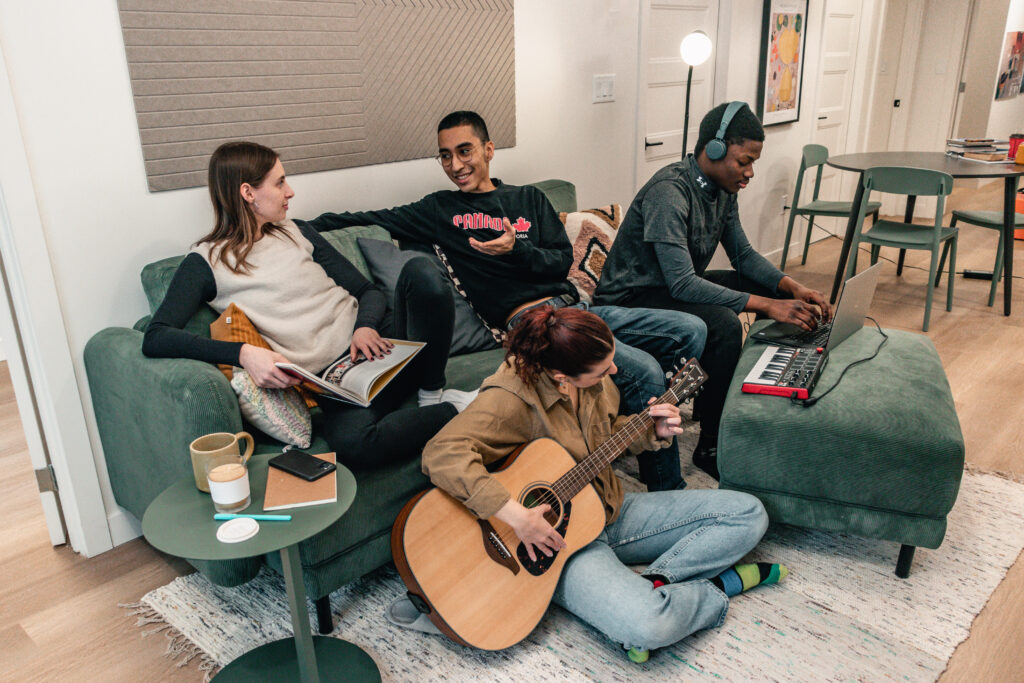 Friends talking and playing music